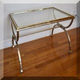 F19. Glass and metal coffee table. Small amount of rust on metal. 16”h x 31”w x 21”d - $85 